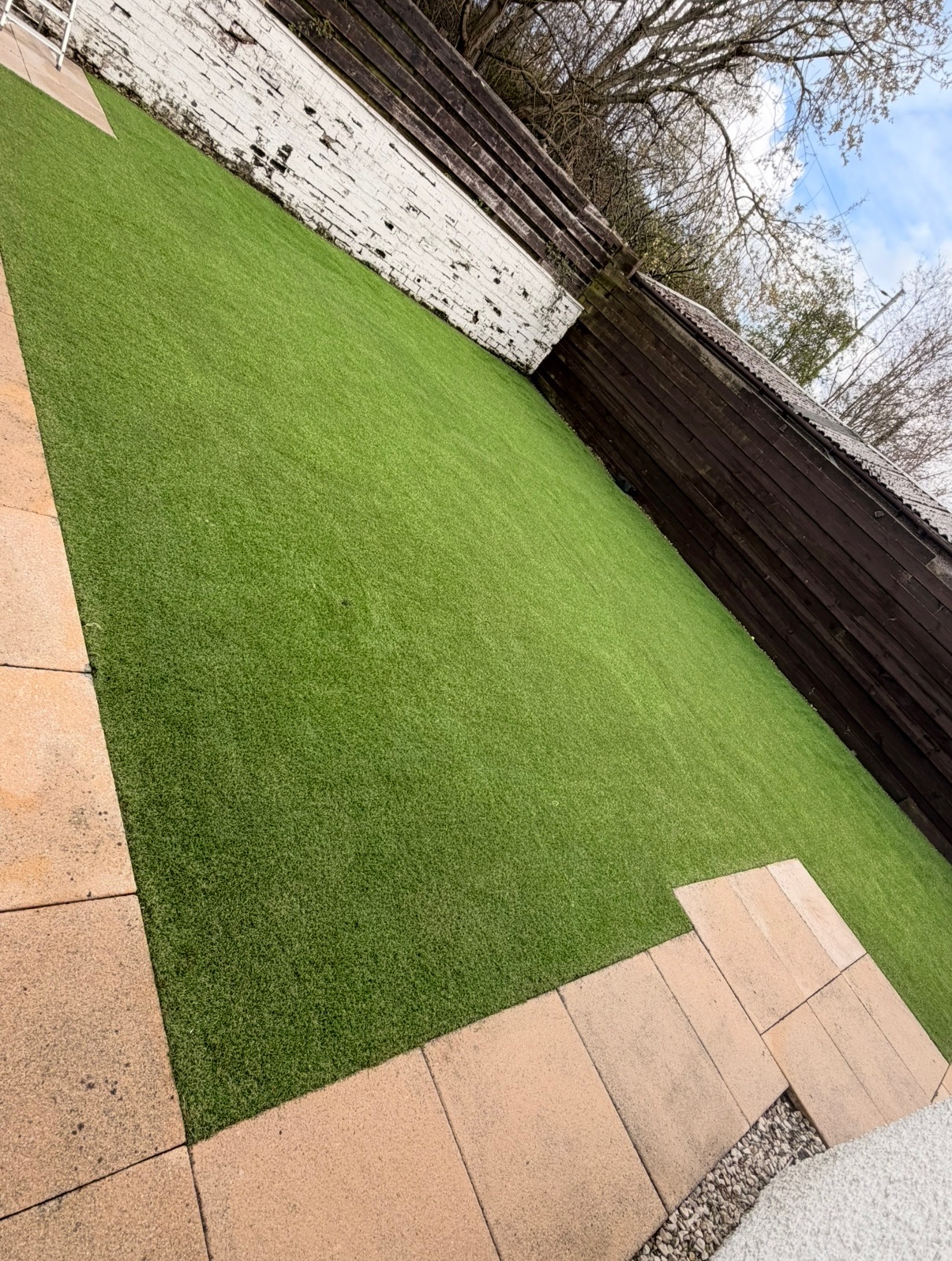 After artificial grass cleaning in Glasgow - fresh green lawn