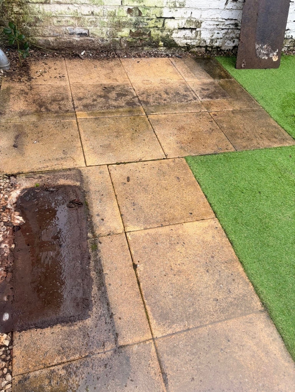 Before patio cleaning in Glasgow - mossy slabs