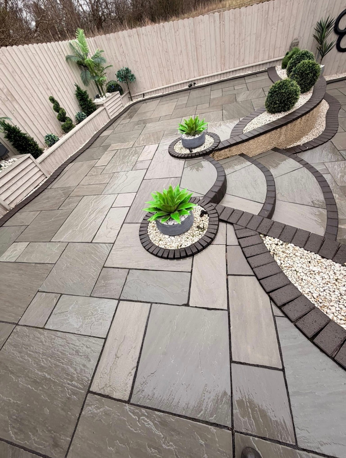 Premium grey patio with planters in Stirling - professional restoration