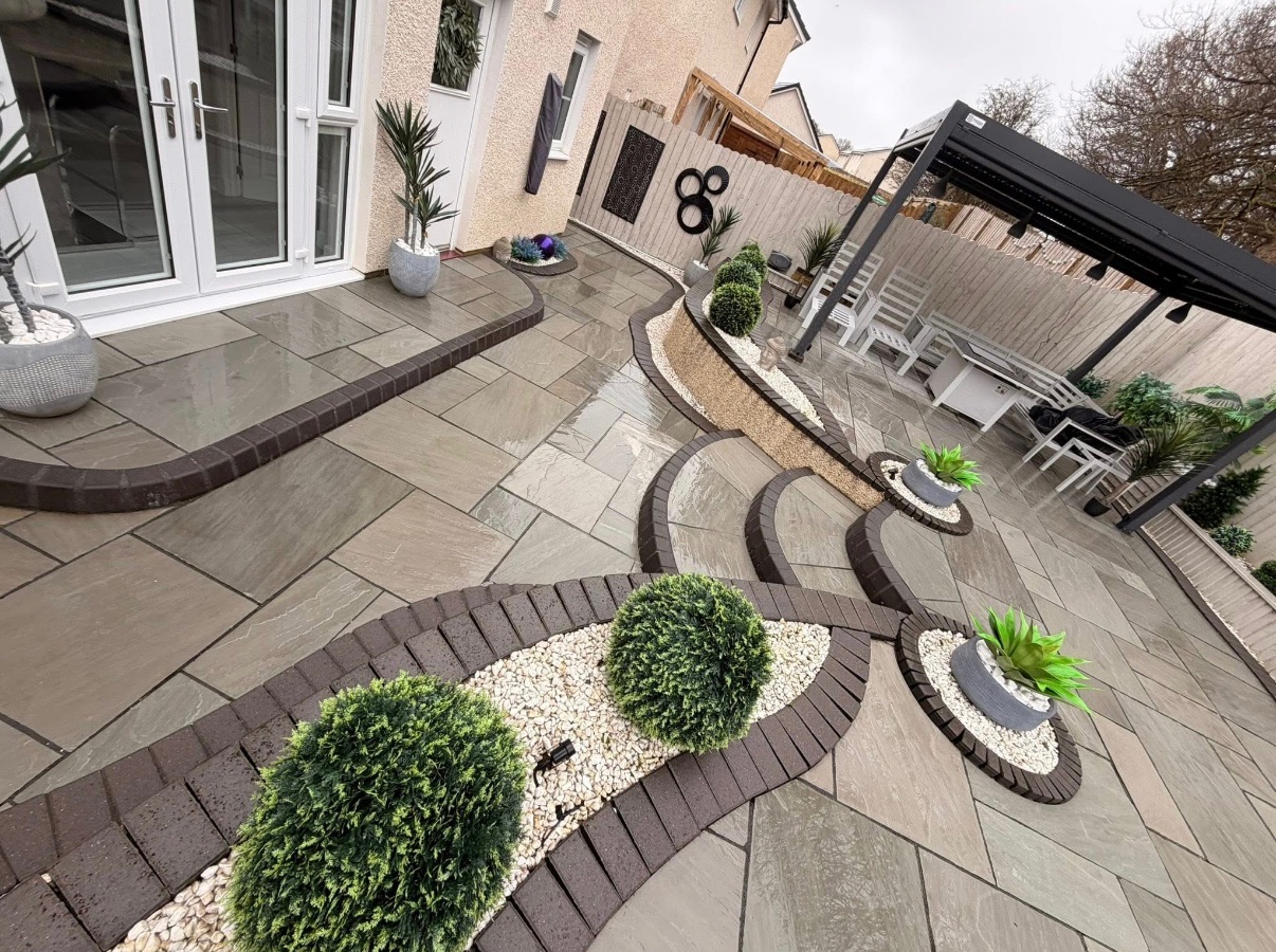 Premium patio restoration in Glasgow - decorative stone paving with pergola